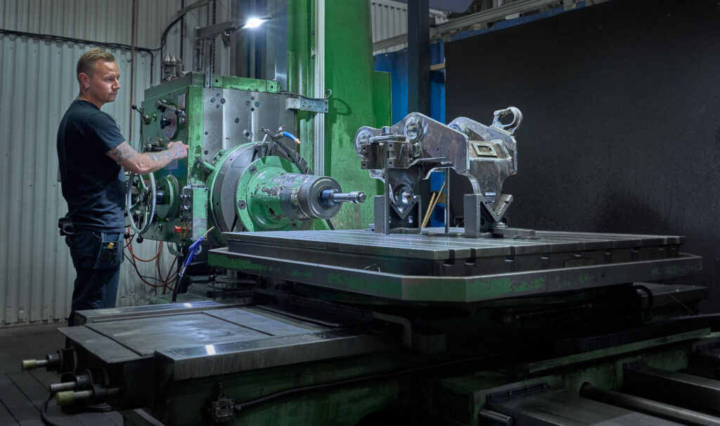 production facility showing manufacturing of quick couplers for excavators in sweden