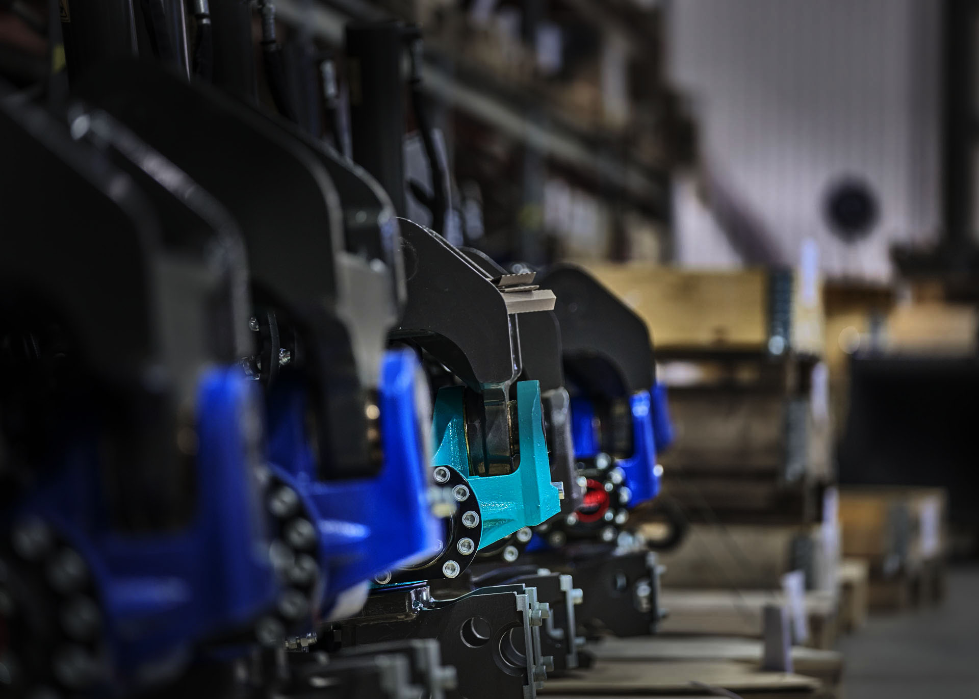 four tiltrotators from SMP lined up in the warehouse